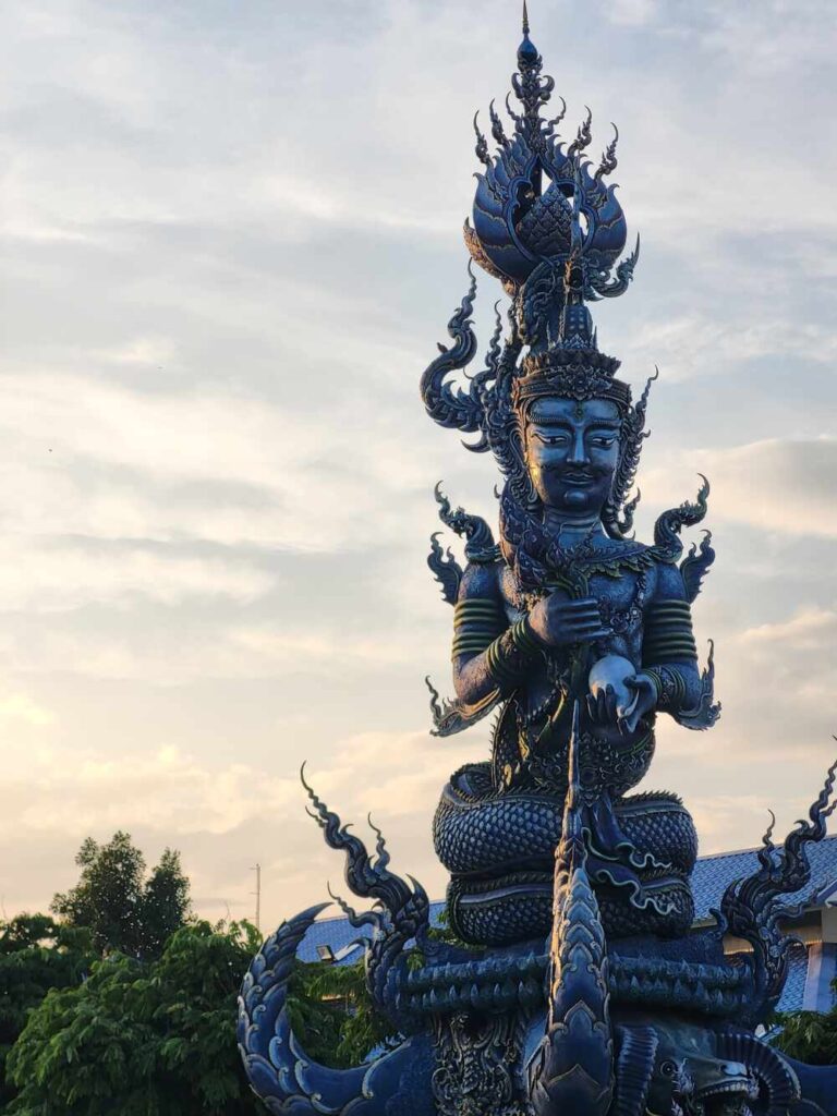 One of the two pillars at the entrance of the Blue Temple in Chiang Rai