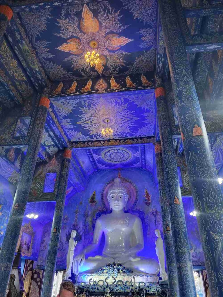The view of the detailed walls inside the Blue Temple in Chiang Rai
