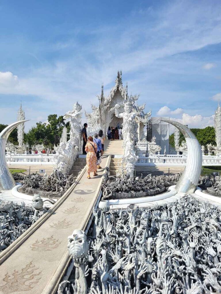 The grand walkway to the inside of the White Temple in Chiang Rai