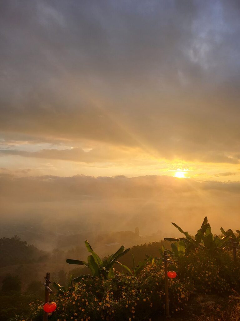 The sunrise at the Chinese Lookout close to Pai, looking over the surrounding misty mountains.
