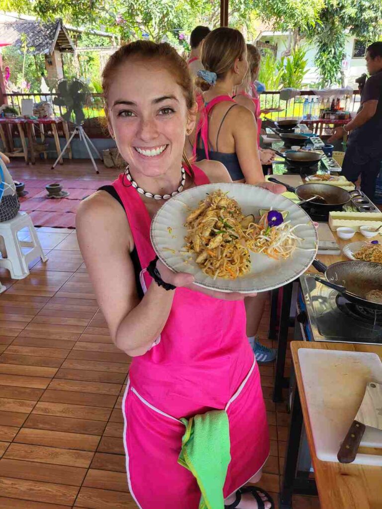 Taking a Thai cooking class was one of my favorite things to do in Thailand. This is me with my home made pad thai.