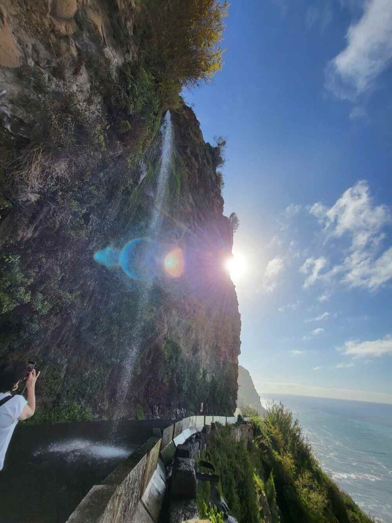 The beautiful Waterfall of Angels stop in Madeira. The fall splash onto the road, creating a beautiful site and interesting car wash.