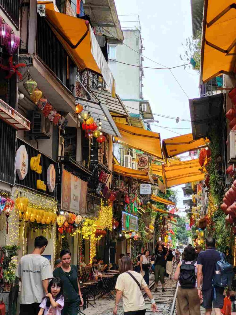 Hanoi Train Street in Vietnam. With the markets and cafes surrounding the train tracks.