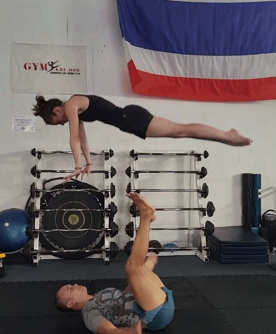 A photo of my being thrown in the air in the Thailand gymnastics class. 